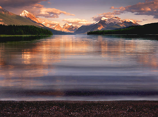 Sunset winds stir the placid waters of a beautiful lake in the Canadian Rockies.
